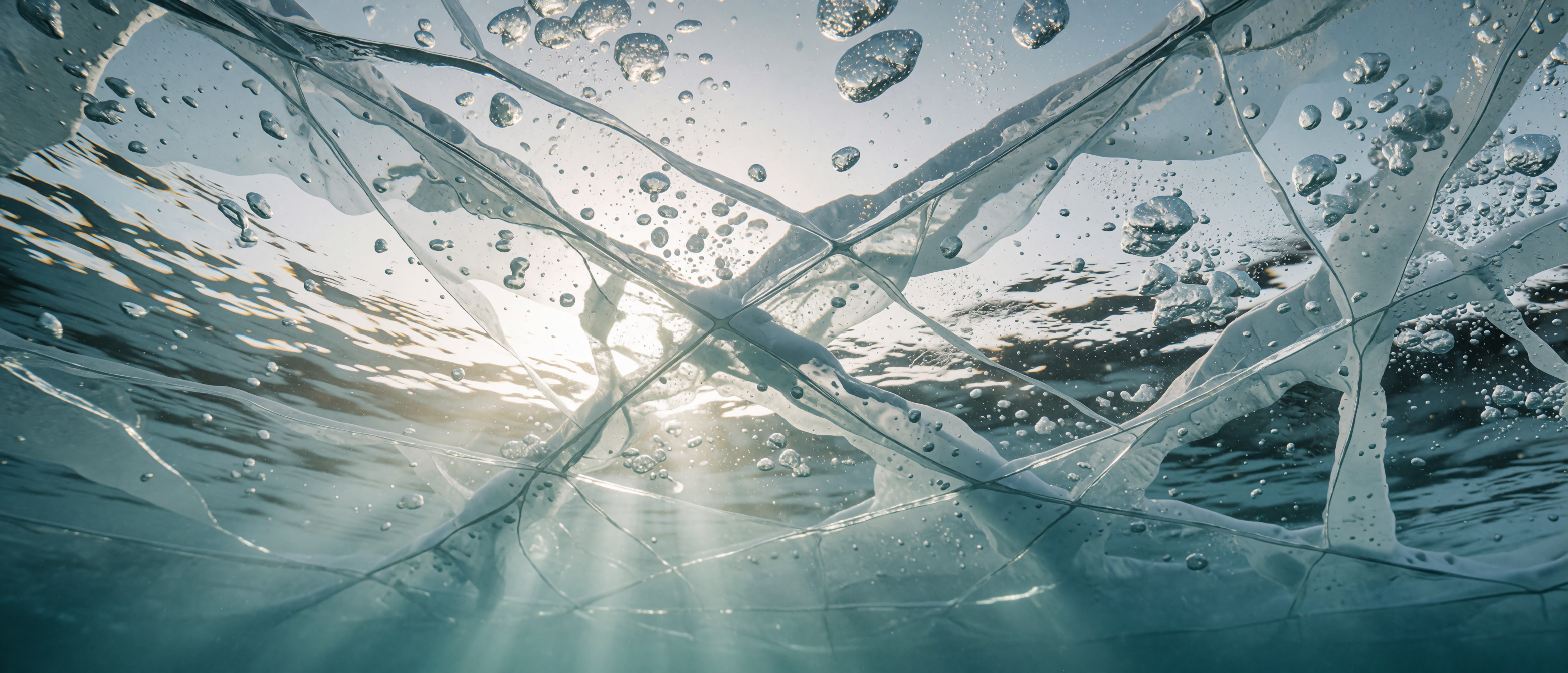 beneath-frozen-lake-ice-surface-bubbles-light-ultrawide